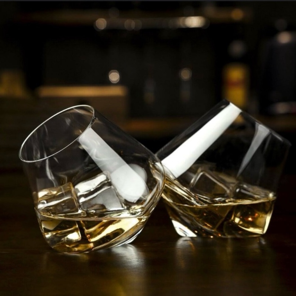 Clear glass snifters, rolling/spinning